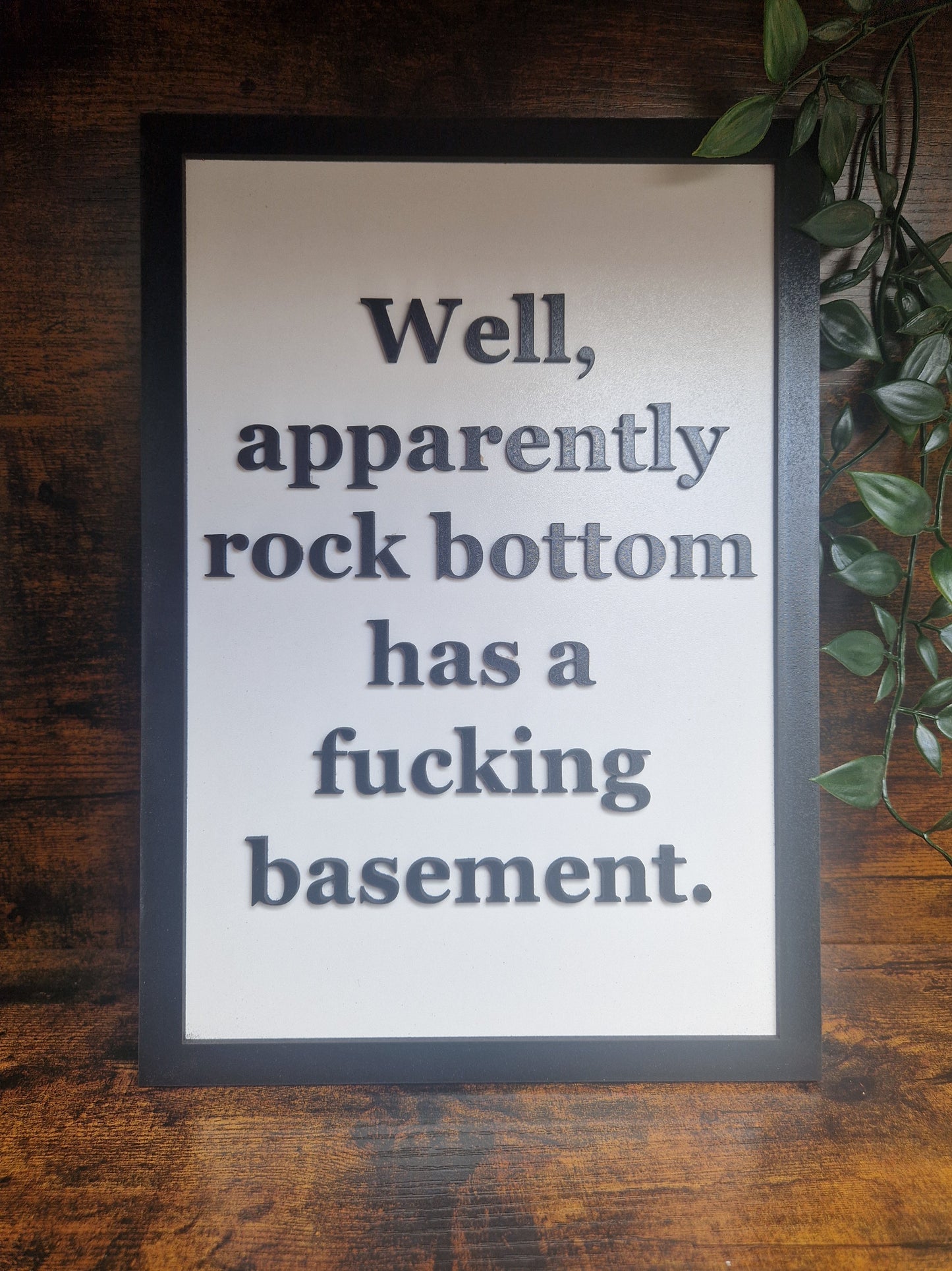 Rock bottom funny sign